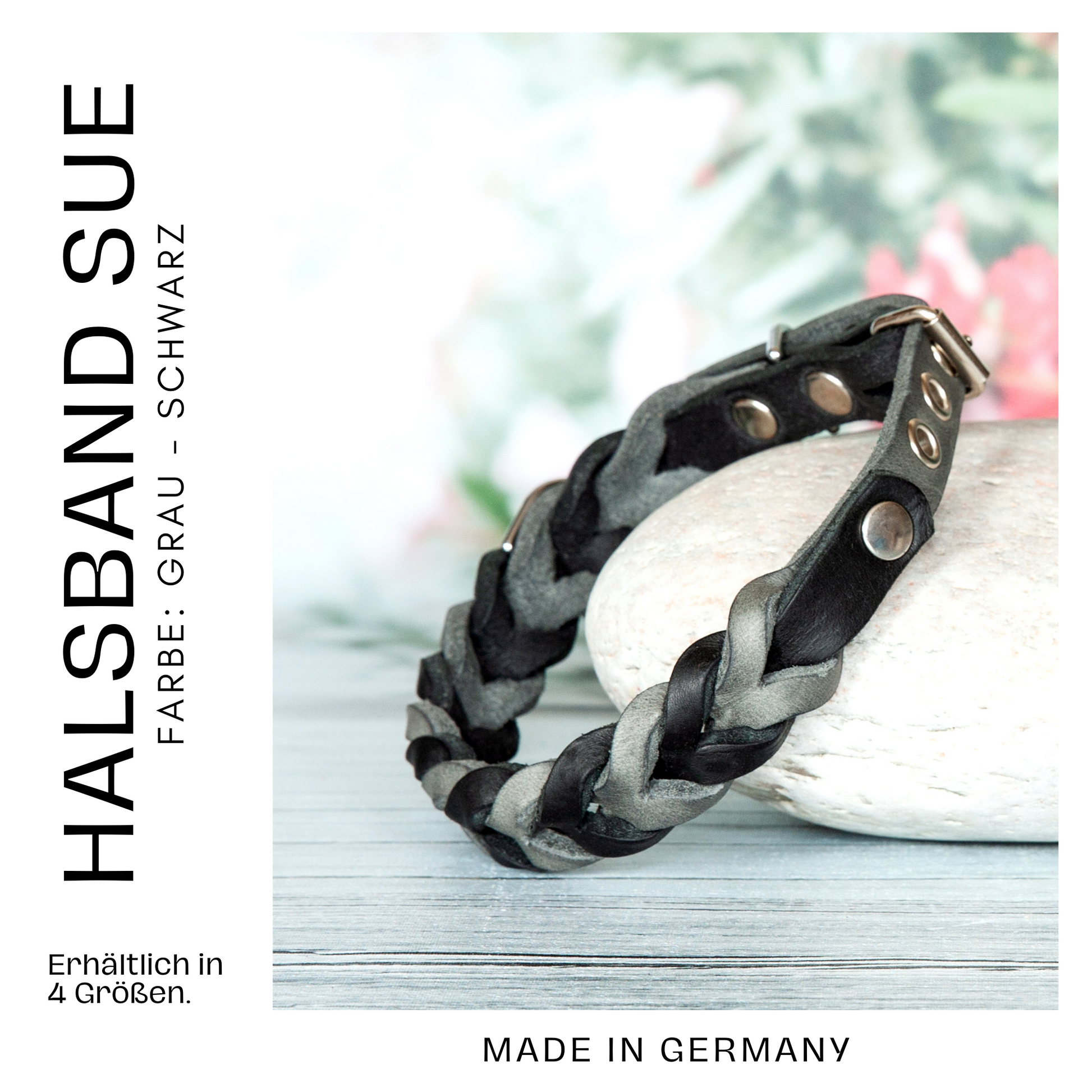 Halsband Sue in Grau-Schwarz aus handgeflochtenem Premium-Leder, auf einem Stein dekorativ platziert – made in Germany.